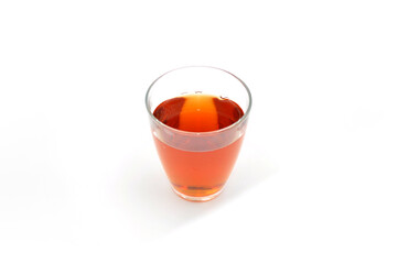 glass with tea on a light background
