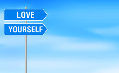Love yourself is written on the signboard at the roadside with a sky view background.