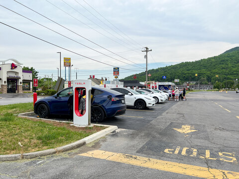 Tesla cars charging at a Tesla Supercharger Station in Tennessee.