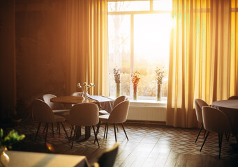 Empty cozy interior restaurant at sunset indoor
