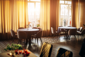 Empty cozy interior restaurant at sunset indoor
