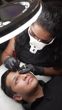 Male microblading procedure to making permanent eyebrows makeup