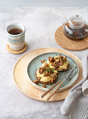 Cozy breakfast Scrambled eggs with chanterelle on buns with tea, copy space - 507380749