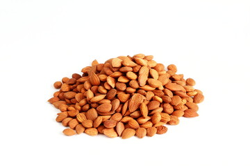 heap of brown dry fruit apricot seeds isolated in white background