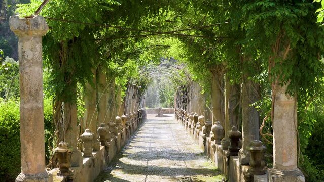 Alley with water fountain in the Alfabia gardens and nature park in the Tramuntana mountain - Bunyola, Mallorca, Balearic Islands, Spain