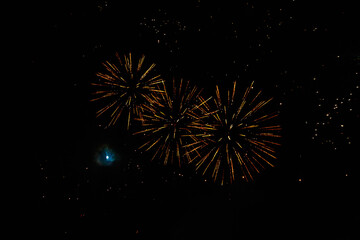 Very beautiful fireworks against the black sky. Graphic resource for design. Underlay or undercoat