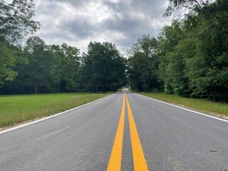 Rural country road clouds and forest in Georgia