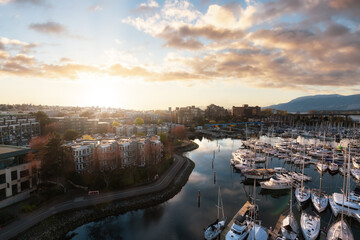View of Vancouver City in False Creek, BC, Canada. Sunny Cloudy Day. Modern Cityscape, Granville Island, residential homes, marina and buildings. Sunset Sky Art Render