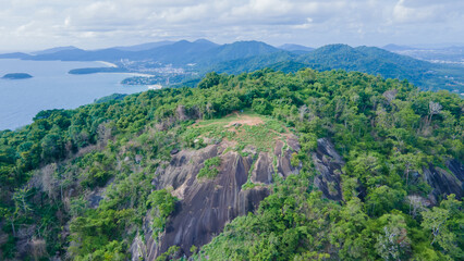 Naklejka premium aerial view, drone, black rock viewpoint sunset viewpoint phuket thailand during the rainy season