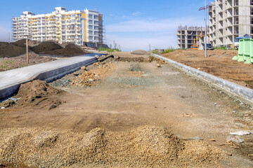 backfilling of the roadbed and arrangement of footpaths in the area under construction