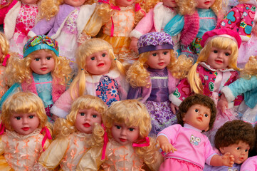 Beautiful cute girl baby dolls for sale at retail shop at Christmas market, New Market area, Kolkata, West Bengal, India.