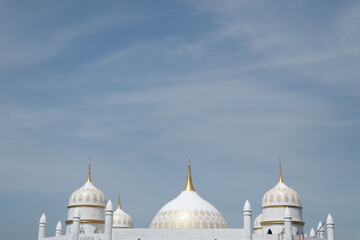 the dome of the mosque under the blue sky
