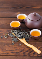 cup of tea and teapot on wooden table
