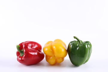 Fresh green sweet pepper yellow sweet pepper and red sweet pepper isolated on a white background. Green bell pepper. Red bell pepper. Yellow bell pepper.  have copy space.