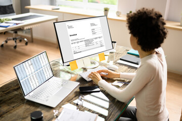 Fototapeta na wymiar Accountant Using E Invoice Software At Computer