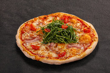 Pizza with bacon and rucola
