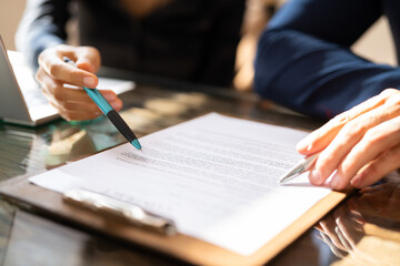 Two Businesspeople Analyzing Document