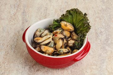 Tasty marinated mussels in the bowl