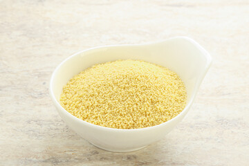 Raw couscous in the bowl