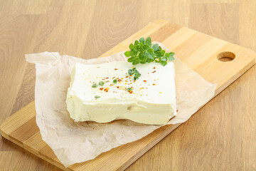 Greek Feta cheese over board