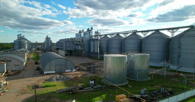 Storage facility for soy and wheat grains. Harvesting. Grain elevator aerial view.