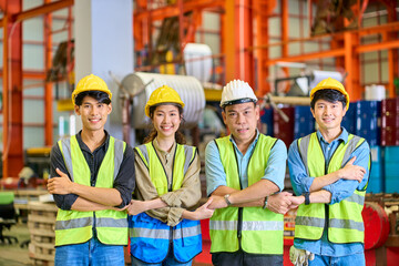 Teamwork of Engineers join hand in metal sheet factory