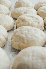 Fototapeta na wymiar Dough balls for making pastries close-up