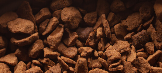 Instant coffee granules as background.