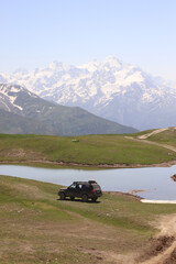 SUV near Lake Koruldi in the mountains of Svaneti, Georgia