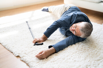 Senior Man Fallen On Carpet