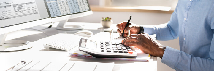 Businessperson Calculating Invoice