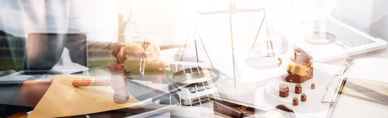 justice and law concept.Male judge in a courtroom on wooden table and Counselor or Male lawyer working in office. Legal law, advice and justice concept.