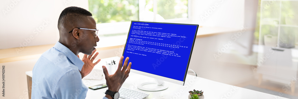 Poster Worried Man At Computer With System Failure On The Screen
