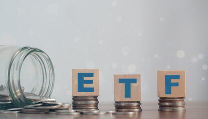 ETF (Exchange Traded Fund), business/finance. Wooden cubes with the letters ETF arranged in a...