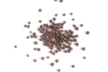 Heap of black pepper peas isolated on white background. Herbs and spices.