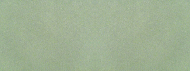 Textured paper green background. Light green marble-like paper material with texture for background