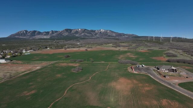 Aerial LDS temple church Monticello Utah pull. Settled in July 1887 by pioneers from The Church of Jesus Christ of Latter-day Saints.  Uranium mine and refinery mill boom from the late 1940s