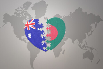 puzzle heart with the national flag of bangladesh and australia on a world map background. Concept.