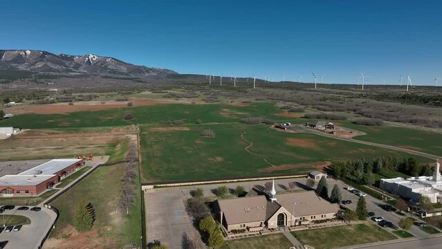 Aerial church school farms Monticello Utah. Settled in July 1887 by pioneers from The Church of Jesus Christ of Latter-day Saints.  Uranium mine and refinery mill boom from the late 1940s.