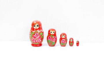 Wooden nesting dolls on a white background