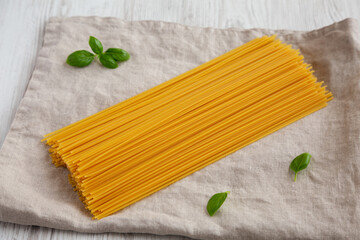 Raw Organic Spaghetti Pasta in a Bunch, side view.
