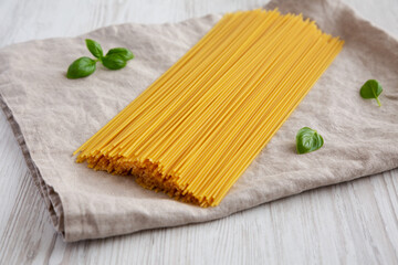 Raw Organic Spaghetti Pasta in a Bunch, side view.