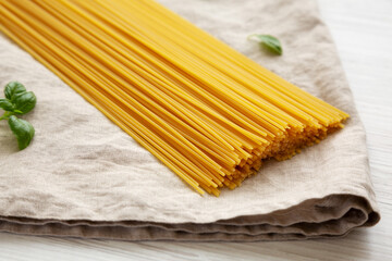 Raw Organic Spaghetti Pasta in a Bunch, side view. Close-up.