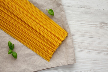 Raw Organic Spaghetti Pasta in a Bunch, top view. Flat lay, from above, overhead.