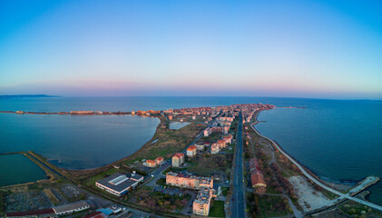 Panoramic view from a height above the town of Pomorie with houses and streets washed by the Black Sea in Bulgaria