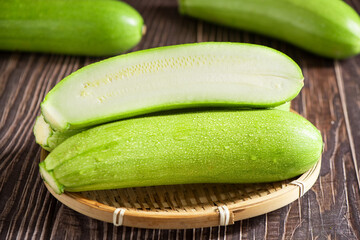 zucchini or marrow on wooden table with clipping path