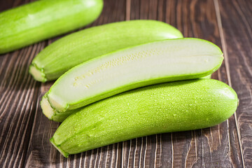 zucchini or marrow on wooden table with clipping path