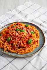 Homemade Spaghetti with Olives and Tomato Sauce, side view.