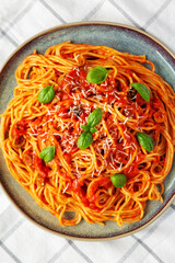 Homemade Spaghetti with Olives and Tomato Sauce, top view. Flat lay, overhead, from above.