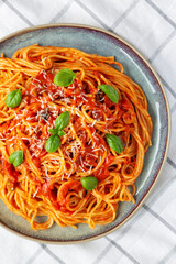 Homemade Spaghetti with Olives and Tomato Sauce, top view. Flat lay, overhead, from above.